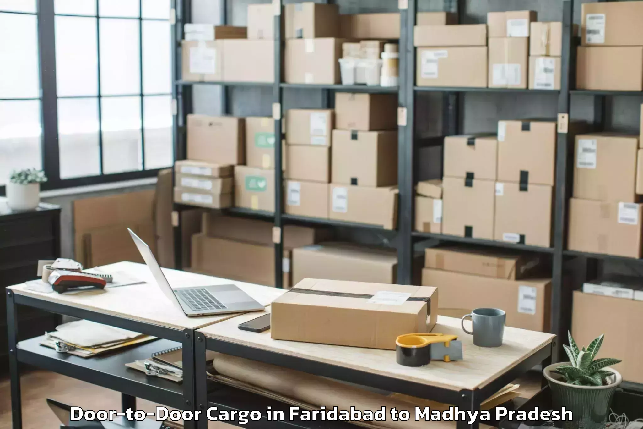 Get Faridabad to Badnawar Door To Door Cargo